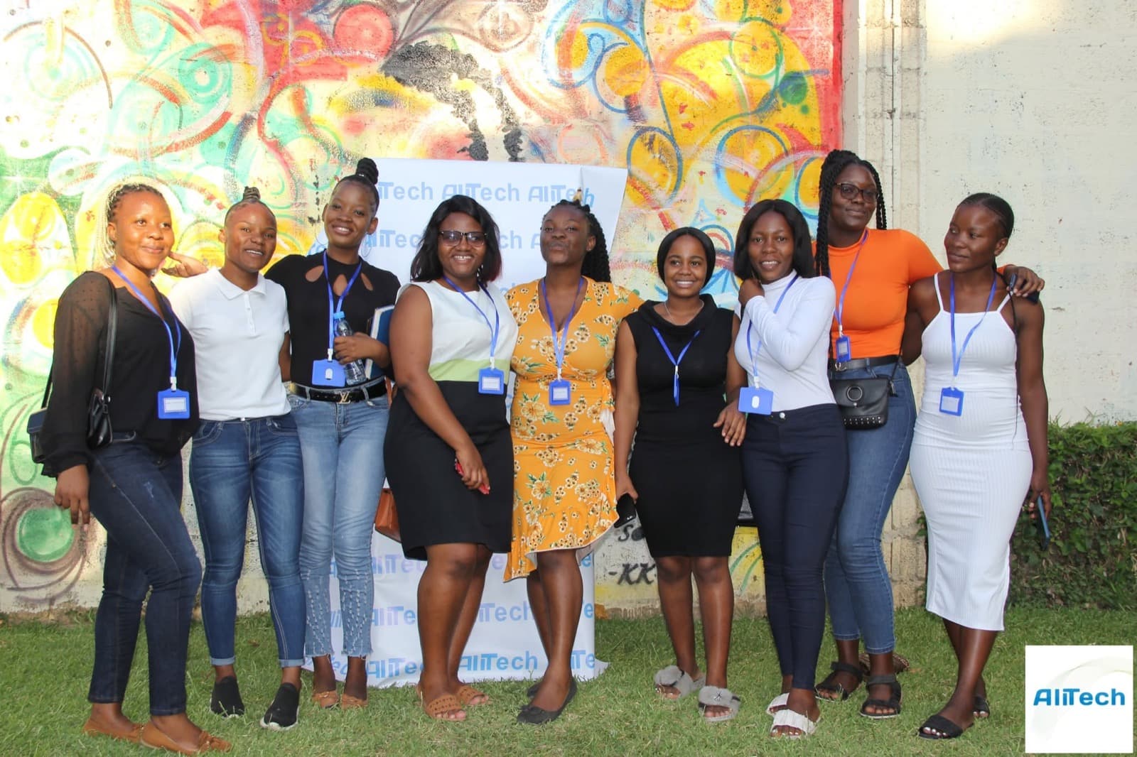 Members of the AliTech community standing together at an AliTech event